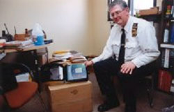 Officer Richard Wadleigh shows the AED Rowan recently purchased / Media Credit: Bryan Littel